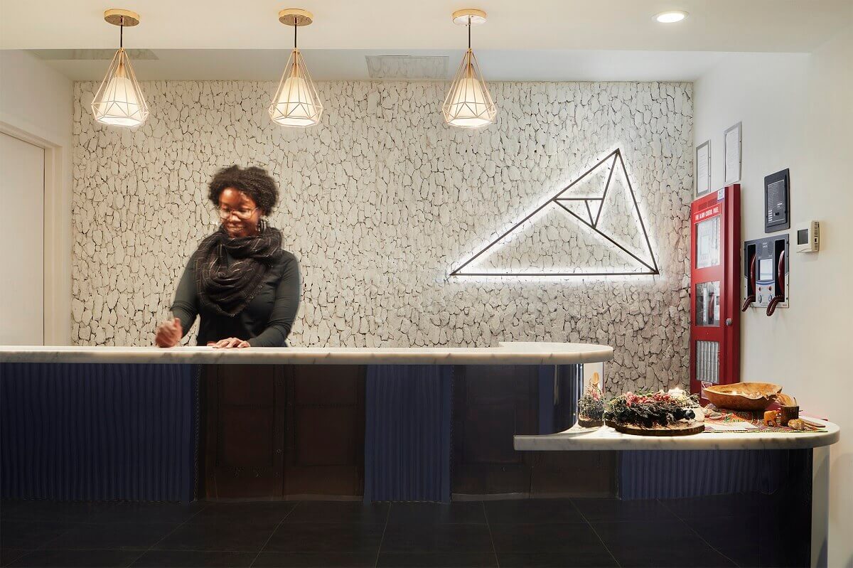 Assemblage John Street Location Reception Area Illuminated Custom Triangular Logo